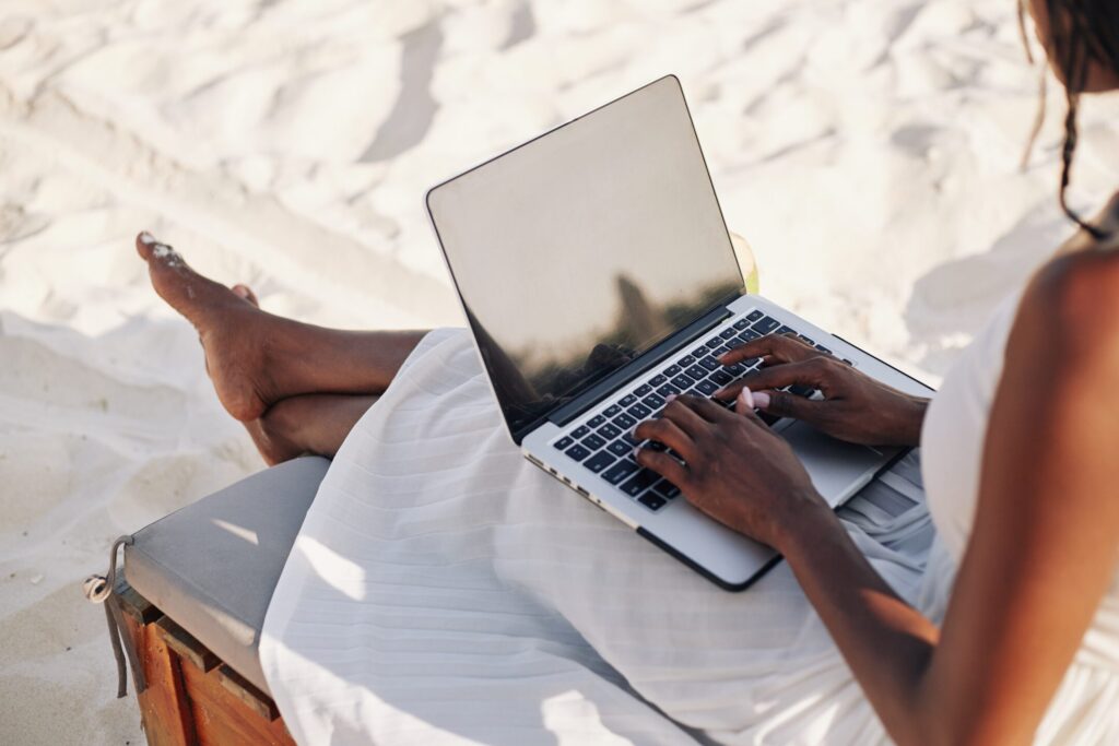 digital nomad on a sand beach